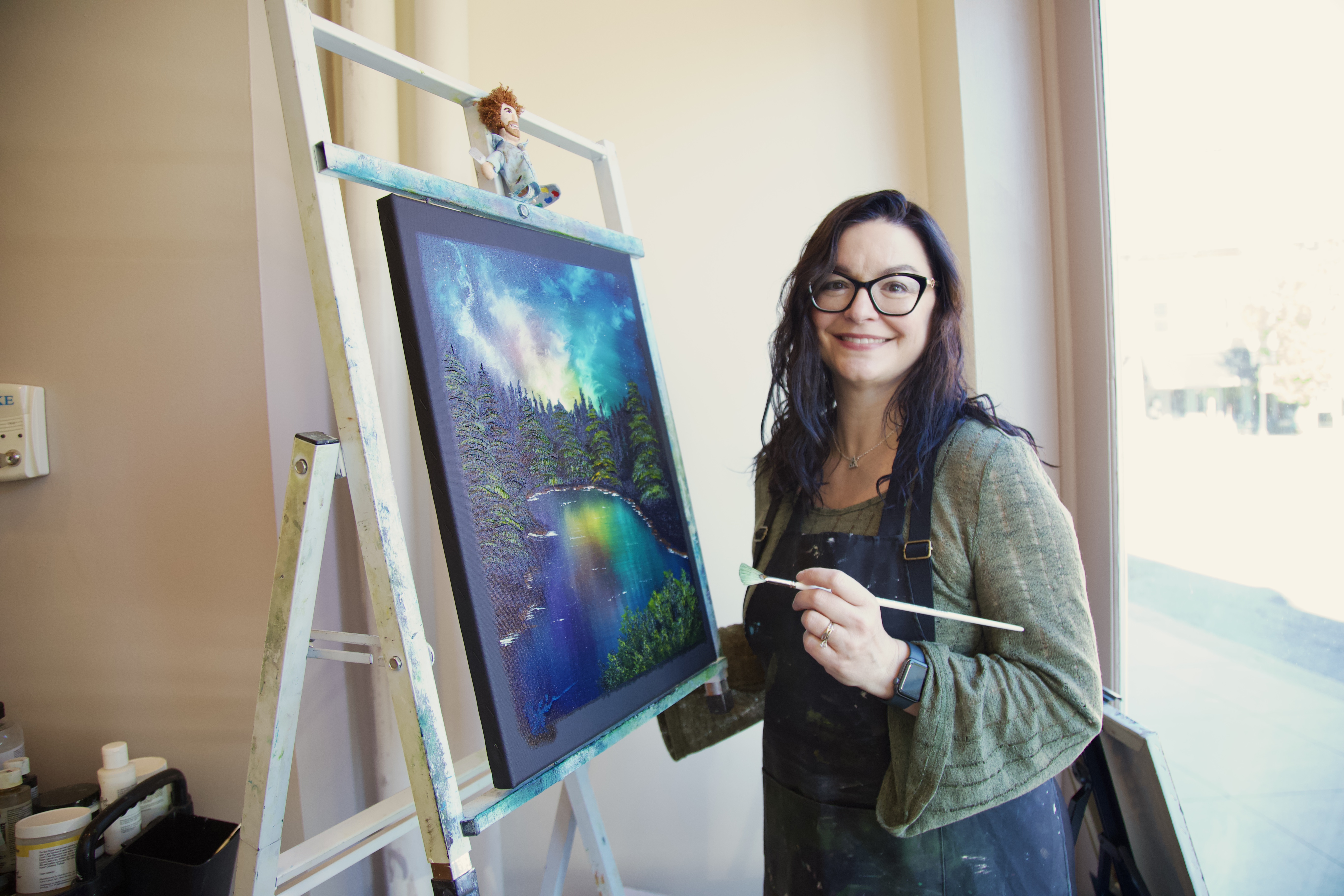 Brenda Fineman working on an oil painting in her studio